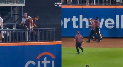 mets fan falls onto field|mets fan falls off field.